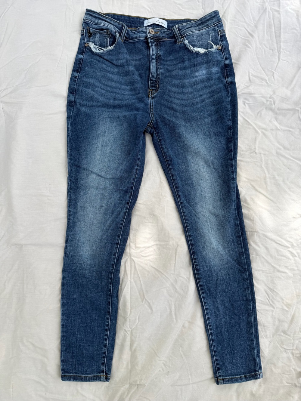 KanCan Curvy Skinny Jeans in Dark Blue Wash and distressed pockets